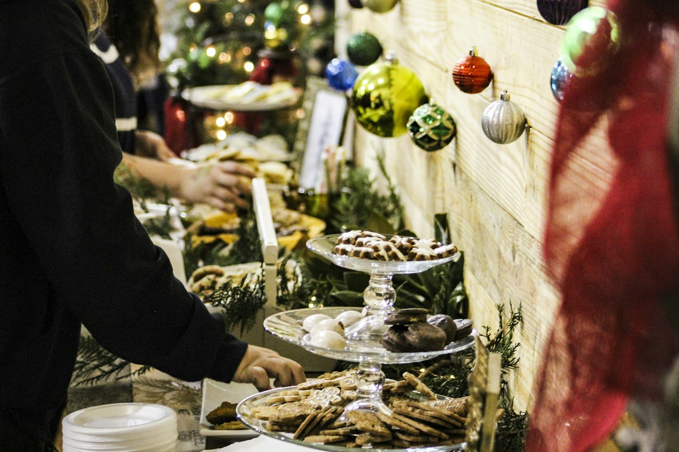 Guests serving themselves at a holiday buffet
